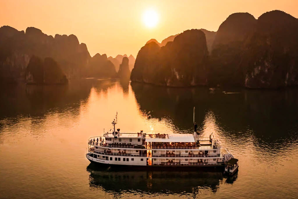 Awaken to Halong Bay’s golden glow aboard Emeraude